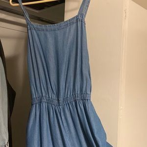 Flowy wide leg with belt jumpsuit in jean blue.
